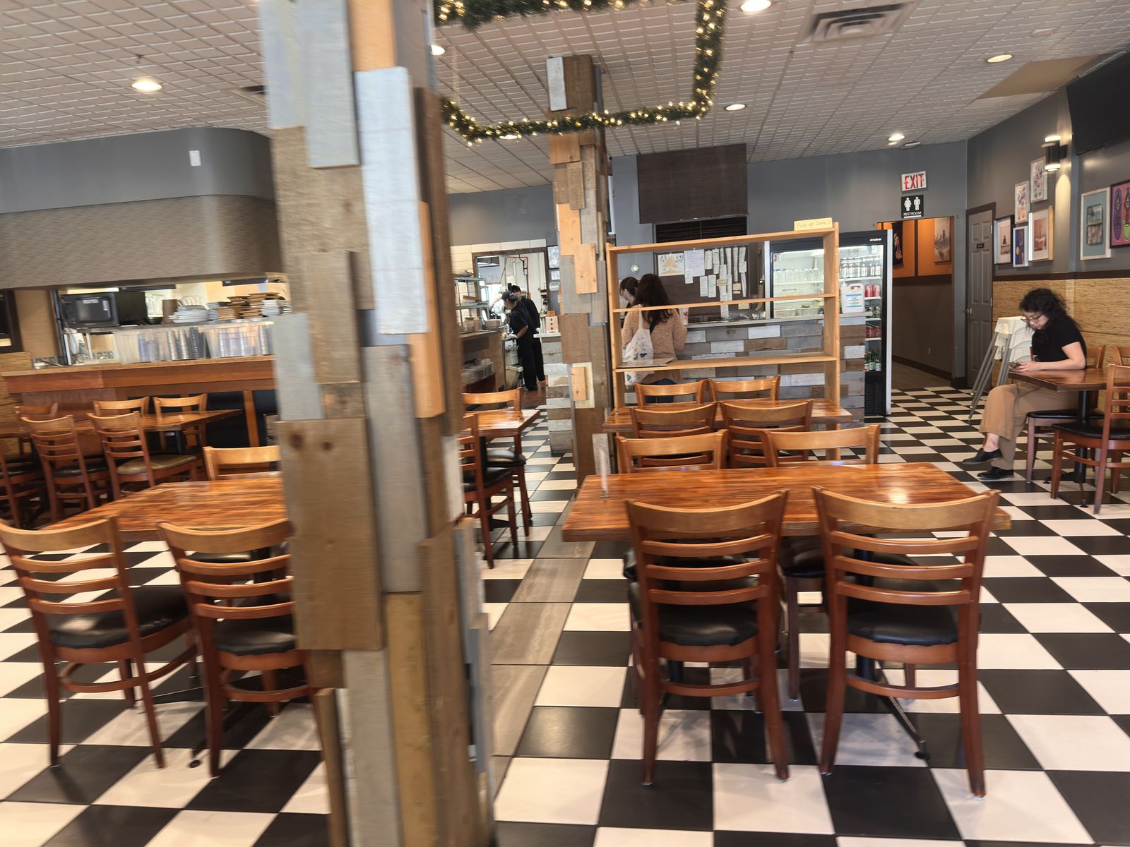 Good Sushi dining room, checkered floor and wood tables