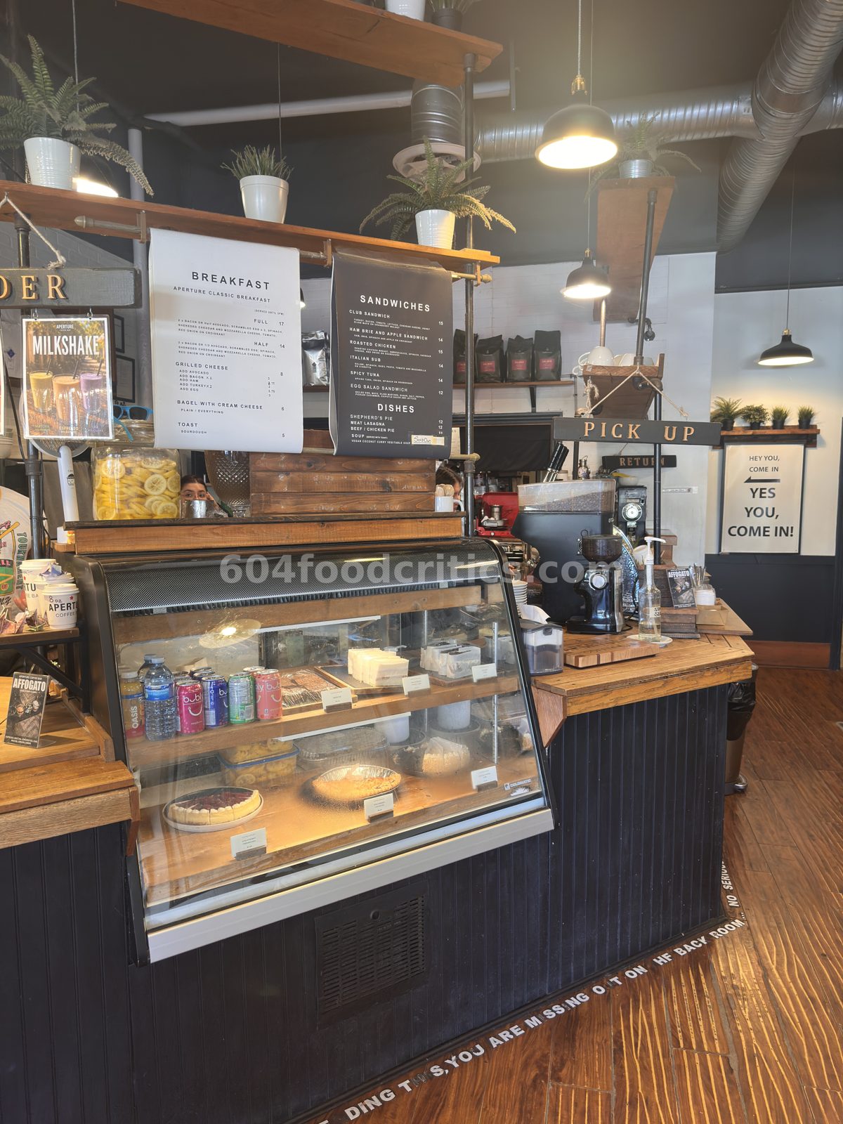 Order counter at Aperture Coffee Bar with floor tip about the back room