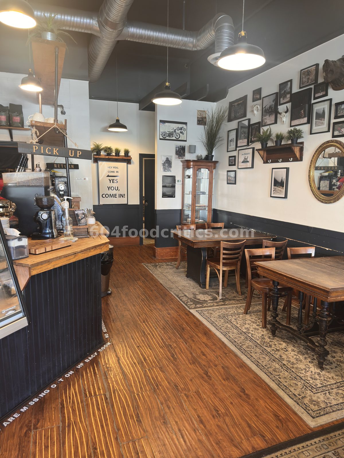 Front room seating and gallery wall at Aperture Coffee Bar