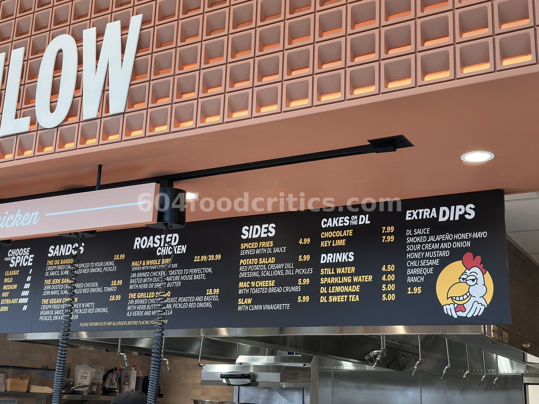 DownLow Chicken menu board at Time Out Market Oakridge: roasted chicken, sides, cakes, drinks and extra dips