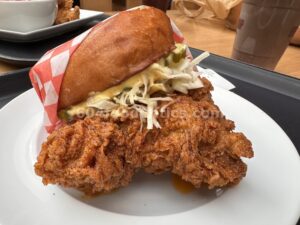 DownLow OG Sando with crispy Nashville hot chicken, slaw, pickles and DL sauce at Time Out Market Oakridge