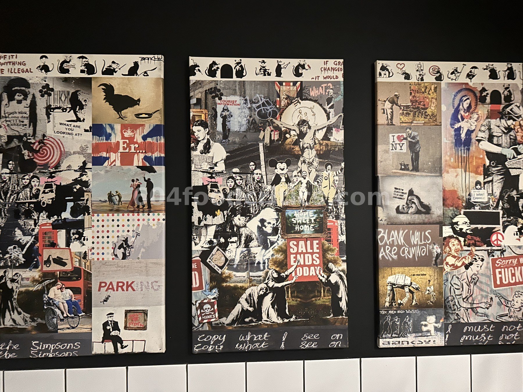 Three canvas prints in Takenaka's washroom showing a collage of Banksy-style stencil street art